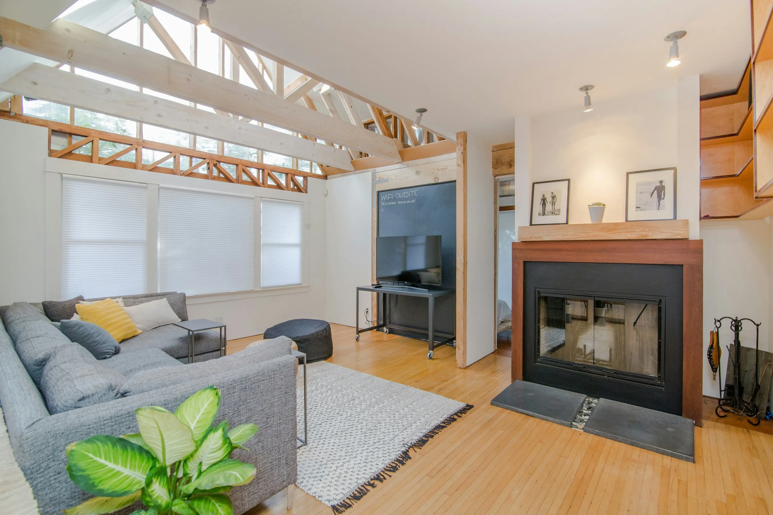 Modern living room with vaulted ceilings and exposed beams