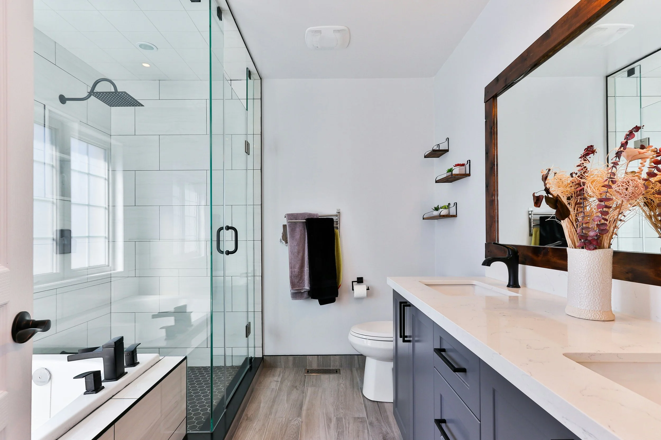 Farmhouse bathroom with double vanity and soaking tub